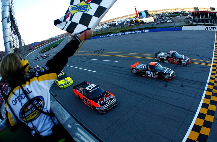 In the closest finish in series history when using electronic scoring, (0.002 seconds) Kyle Busch passes Aric Almirola for the win on the final lap in Saturday’s NASCAR Camping World Truck Series Mountain Dew 250 at Talladega Superspeedway. Johnny Sauter finished third. Credit: Jason Smith/Getty Images for NASCAR